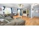 Inviting living room featuring hardwood floors, large windows, and a comfortable seating area at 308 Purdue Rd, Venice, FL 34293