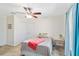 Cozy bedroom with ceiling fan, bright curtains, and stylish neutral decor at 31 Ramblewood St, Port Charlotte, FL 33953