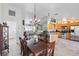 Open dining area and kitchen boasts stainless steel appliances, tile floors, and an open floor plan at 31 Ramblewood St, Port Charlotte, FL 33953