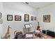 Music room featuring a giraffe statue, electric guitar, music stand, colorful rug, and walls adorned with framed artwork at 31 Ramblewood St, Port Charlotte, FL 33953