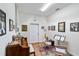 A well-lit music room featuring a piano, music stand, colorful rug, and walls adorned with framed artwork at 31 Ramblewood St, Port Charlotte, FL 33953