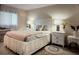 Comfortable bedroom with a white bed frame, soft lighting, and coordinating nightstands at 3224 Mount Hope St, North Port, FL 34287