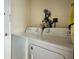 Functional laundry area with a washer and dryer set, offering convenience at 3224 Mount Hope St, North Port, FL 34287
