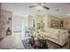 Cozy living room featuring tile floors, ceiling fan, and comfortable seating arrangements at 3224 Mount Hope St, North Port, FL 34287