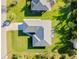 An aerial view showing the home's roof, landscaping, and proximity to neighboring properties at 3447 Nadasky Ave, North Port, FL 34288