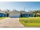 Attractive single-story home with an attached two-car garage and concrete driveway at 3447 Nadasky Ave, North Port, FL 34288