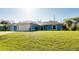 A well-maintained home with a two-car garage, set against a bright, sunny sky at 3447 Nadasky Ave, North Port, FL 34288