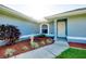 Charming front entrance with manicured landscaping and a well-lit walkway at 3447 Nadasky Ave, North Port, FL 34288