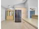 Bright kitchen showcases stainless steel refrigerator, pantry and built in cabinet at 3447 Nadasky Ave, North Port, FL 34288