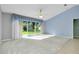 Living room featuring lots of natural light and a sliding door leading to the backyard at 3447 Nadasky Ave, North Port, FL 34288