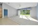 Spacious living area with large sliding doors that provide natural light and backyard views at 3447 Nadasky Ave, North Port, FL 34288