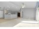 Open-concept living area with a ceiling fan and sliding doors that lead to the backyard at 3447 Nadasky Ave, North Port, FL 34288