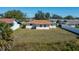 Rear view of a well-kept home with fenced-in yard at 358 Pineview Dr, Venice, FL 34293