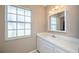 Bathroom with a single sink vanity, and large window at 358 Pineview Dr, Venice, FL 34293
