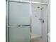 Close up of the shower in the bathroom featuring glass doors and tile floors at 358 Pineview Dr, Venice, FL 34293