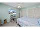 Bright bedroom featuring a ceiling fan, fresh paint, and a cozy window view at 358 Pineview Dr, Venice, FL 34293