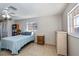 Bedroom featuring a ceiling fan, and two windows at 358 Pineview Dr, Venice, FL 34293