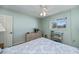 Bedroom with neutral color palette and plenty of natural light from the window at 358 Pineview Dr, Venice, FL 34293