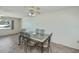 Dining area with a decorative table and seating for six at 358 Pineview Dr, Venice, FL 34293