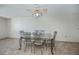 Dining area with glass-topped table and seating for six at 358 Pineview Dr, Venice, FL 34293