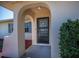 Covered entryway with decorative front door at 358 Pineview Dr, Venice, FL 34293