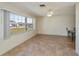 Open living space with tile flooring and large window offering plenty of natural light at 358 Pineview Dr, Venice, FL 34293