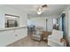 Bright living room features tile flooring, neutral colors, and a view of the kitchen at 358 Pineview Dr, Venice, FL 34293