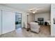 The comfy living room features tile flooring, neutral paint and view to flex room at 358 Pineview Dr, Venice, FL 34293