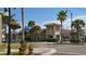 Picturesque street corner showcasing well-maintained buildings, palm trees, and charming street lamps creating a welcoming community atmosphere at 358 Pineview Dr, Venice, FL 34293