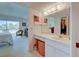 En-suite bathroom featuring a vanity area and access to the bedroom and closet at 418 Cerromar Ct # 261, Venice, FL 34293