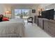 Bedroom featuring a view of the balcony and surrounding foliage at 418 Cerromar Ct # 261, Venice, FL 34293