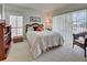 Bright bedroom with a large window and comfortable furnishings at 418 Cerromar Ct # 261, Venice, FL 34293