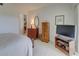 Traditional bedroom featuring classic furnishings, soft carpet, and neutral paint at 418 Cerromar Ct # 261, Venice, FL 34293
