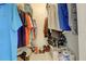 Walk-in closet showcasing ample storage space with clothing and accessories at 418 Cerromar Ct # 261, Venice, FL 34293