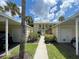 Charming two-story condo with lush landscaping and covered parking spaces at 418 Cerromar Ct # 261, Venice, FL 34293