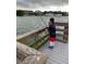 Young boy fishing off a pier with boats docked in the background for a waterfront community at 418 Cerromar Ct # 261, Venice, FL 34293