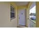 Close up of front door of condo with secure lock and a small storm window at 418 Cerromar Ct # 261, Venice, FL 34293