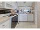 This kitchen features white appliances, plenty of cabinets and stylish countertop at 418 Cerromar Ct # 261, Venice, FL 34293