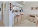 Kitchen bar featuring counter seating with a view into the dining area at 418 Cerromar Ct # 261, Venice, FL 34293