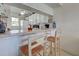 Kitchen bar featuring counter seating with a view into the dining area at 418 Cerromar Ct # 261, Venice, FL 34293