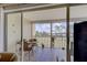 Screened lanai with a nice patio set and a view of the grassy common area at 418 Cerromar Ct # 261, Venice, FL 34293