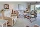 Cozy living room featuring a large seating area and a slider to the balcony at 418 Cerromar Ct # 261, Venice, FL 34293