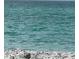Calm turquoise ocean view from the shore, showcasing peaceful waters, a natural and appealing landscape at 418 Cerromar Ct # 261, Venice, FL 34293
