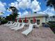 Inviting community pool with plenty of lounge chairs and umbrellas, ideal for relaxation at 418 Cerromar Ct # 261, Venice, FL 34293