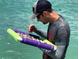 A treasure hunter looking for treasure in the water with a special tray at 418 Cerromar Ct # 261, Venice, FL 34293