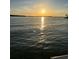 Waterfront view with a sunset reflecting on the water, boats dotting the horizon adding to scenic beauty at 418 Cerromar Ct # 261, Venice, FL 34293
