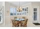 Bright breakfast nook with a glass table and windows, perfect for enjoying morning coffee at 4228 Corso Venetia Blvd, Venice, FL 34293