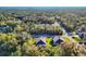 Aerial shot showcasing the homes nestled among lush, mature trees, in a serene and private community at 4324 Knowles Ln, North Port, FL 34288