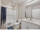 Bathroom features a bathtub with shower, toilet, vanity and mirror at 4324 Knowles Ln, North Port, FL 34288