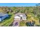 Charming home with a brick driveway, attached garage, bay window, and well-maintained lawn and landscaping at 4324 Knowles Ln, North Port, FL 34288